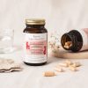 glas met capsules multivitamine